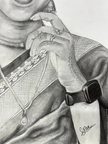 A close-up view of the hand from the previous portrait, showing the detailed line work of the henna design and the texture of the sari fabric.