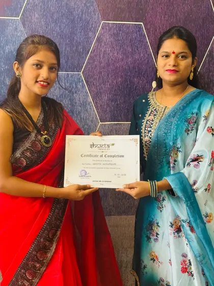Presenting a certificate of completion. My goal is to empower every student with the skills and business knowledge to build their own career.