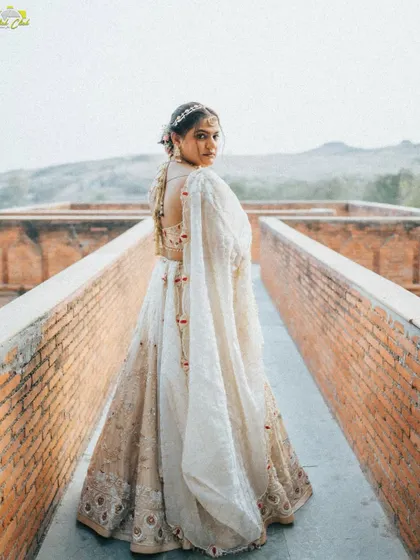 A striking bridal portrait on a brick walkway. The leading lines of the path draw the eye to the bride, creating a powerful and elegant composition.