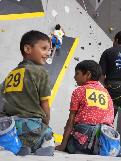A candid moment between two young competitors at our kids' climbing event. The camaraderie and shared excitement are what make our community so special.