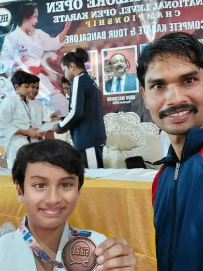 A selfie with one of my young medalists at the Sikka Open, capturing the joy of the event.
