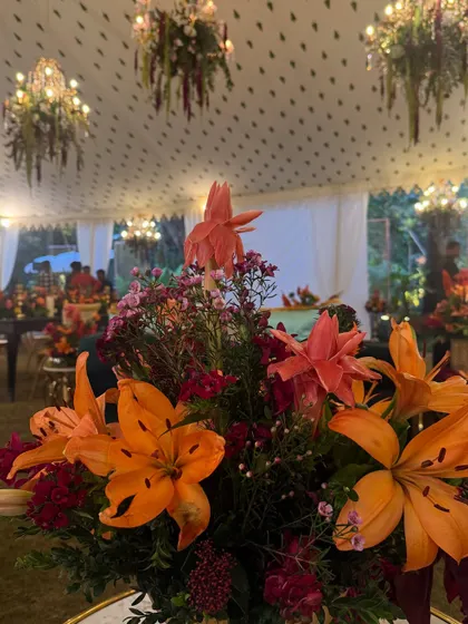 Golden blooms for a golden evening. For this wedding dinner party, our ceiling floral installations with warm, autumnal colors set a soft, wild, and glowing scene as the evening unfolded.