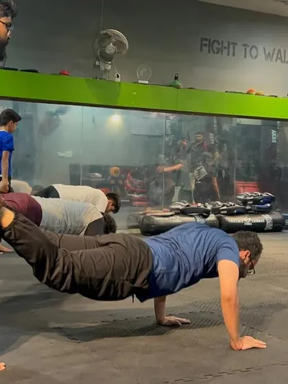 This isn't just a push-up; it's a test of strength and teamwork. Partner drills like this build the physical resilience and trust needed to train effectively and safely.