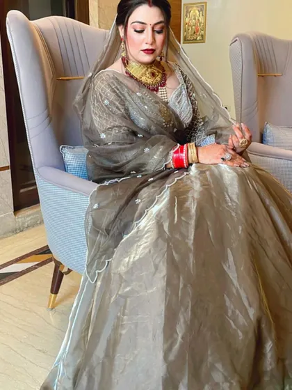 Another angle of the beautiful bride in her grey lehenga, showing the details of her makeup and jewelry.