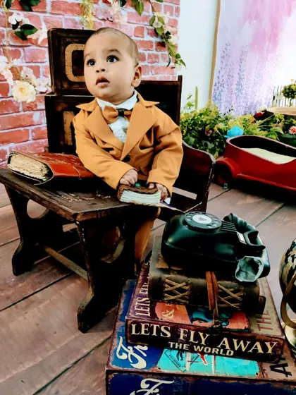 A gallery of our popular school and library theme. These images show the versatility of the brick wall backdrop, mini school desk, globe, and book props for creating a variety of scholarly and classic portraits.