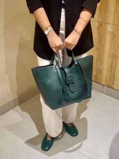 Making Sunday work looks fun with a hint of green. Here, I've paired my green croc-embossed tote with matching green loafers for a coordinated and professional look that still feels fresh.