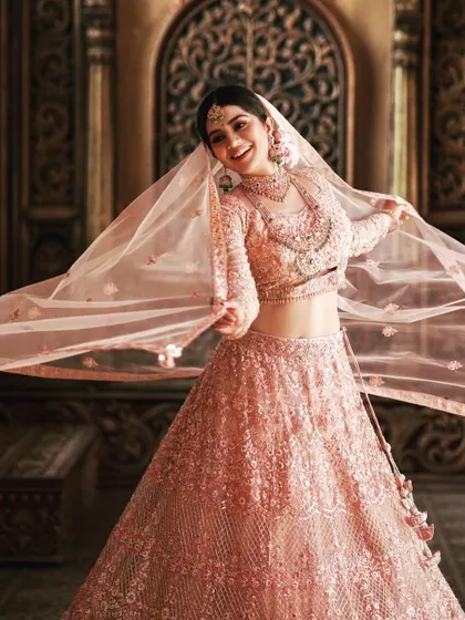 It was a joy to see the wonderful actress Megha Shetty in my creation. This blush pink lehenga, with its delicate full-body embroidery and flowing net fabric, perfectly captures the essence of modern bridal elegance.