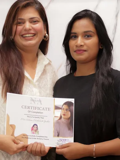 Handing over a certificate to another talented artist. Her dedication during the course was inspiring to see.