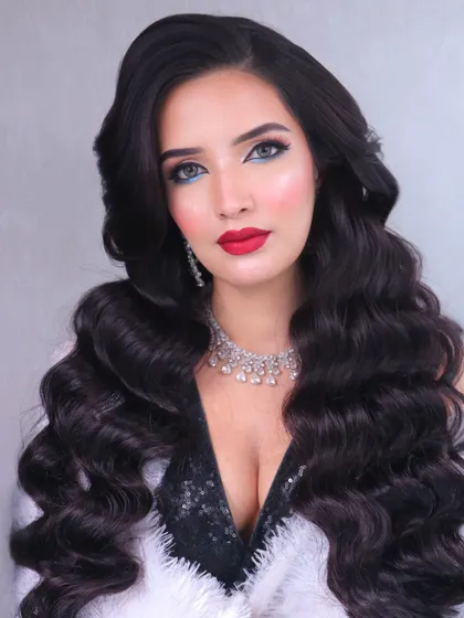 The epitome of glamour. This look is all about confidence, with voluminous hair and striking makeup.