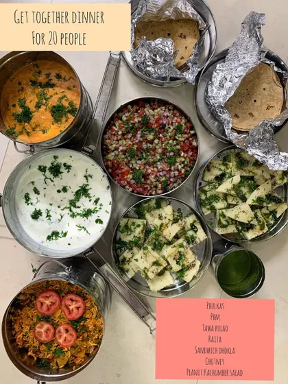 A get-together dinner for 20 people, served in traditional tiffin carriers. The menu included Phulkas, Paneer Butter Masala, Tawa Pulao, and a fresh Peanut Kachumber Salad.