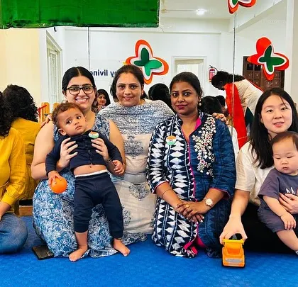Mothers and their babies gather for a photo during our Independence Day event.
