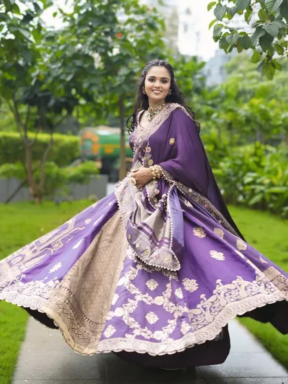 A twirl of happiness. This shot captures the beautiful movement of her lehenga and the joy of her special day.