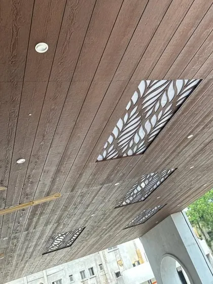 Another angle of the wood-clad ceiling, showing the intricate leaf pattern of the backlit panels. We can create custom designs to spoil you with endless options.