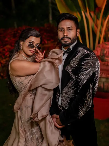 A stylish reception look. We love capturing the glamour and fun of the evening party, from the designer outfits to the happy, candid interactions.