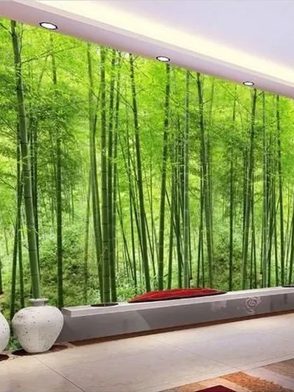 Another view of our popular bamboo forest wallpaper, showing how it can transform a living room wall. The realistic, high-definition print adds depth and a sense of calm to the entire space.