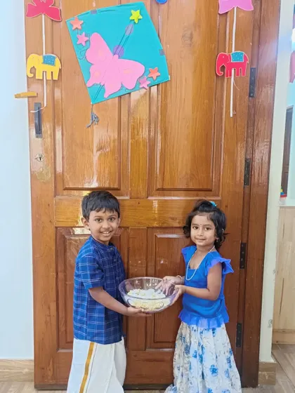 A happy exchange of 'Yellu Bella' between two friends. We celebrate the harvest festival with joy, color, and traditional activities.