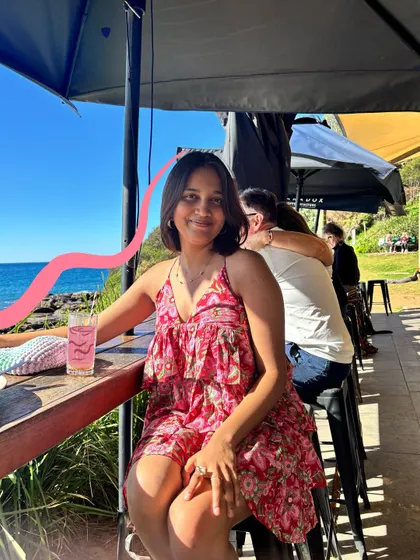 A simple pink squiggle adds a pop of color and movement to this photo of me enjoying a drink by the sea in Sydney.