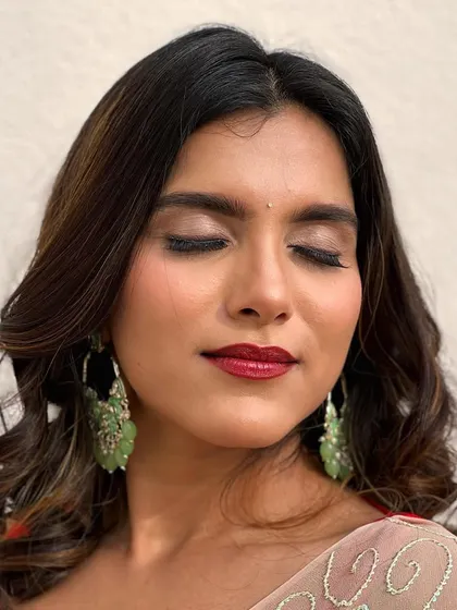 A close-up showing the shimmer of the champagne eyeshadow. This look is all about sophisticated glamour.