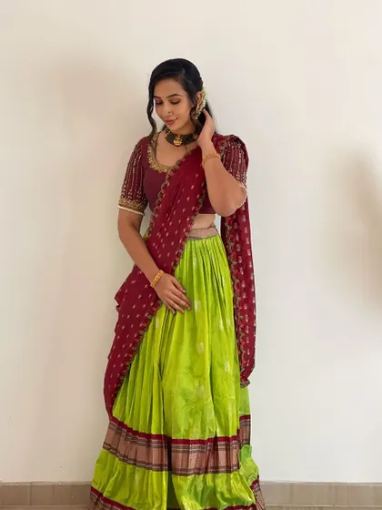 This view shows how the dupatta is draped traditionally over the shoulder. We ensure all our rental outfits are maintained in excellent condition for you.