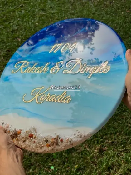 This is the final look of the 3D ocean-themed nameplate I created for a client's new home. The layering of resin creates realistic waves, and the real sand and shells add beautiful texture.