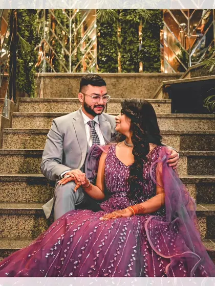 An intimate moment on the stairs, with the couple sharing a look. We focus on capturing the connection and chemistry between you.