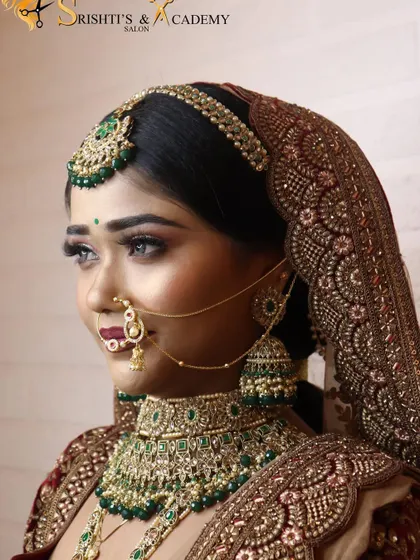 A close-up profile shot that showcases the precision of the makeup. The winged eyeliner, perfectly blended eyeshadow, and defined brows create a captivating look.