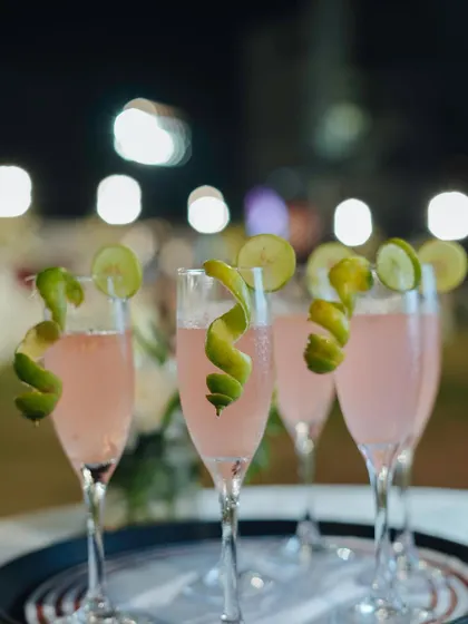 Cheers to elegance. Our pink mocktails, served in champagne flutes with a lime twist garnish, are a sophisticated and visually stunning beverage choice.