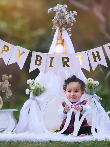 A picture perfect first birthday setup. I provide everything needed, from the "Happy Birthday" banner and teepee tent to the milestone props, to create a beautiful setting for your baby's special photoshoot.