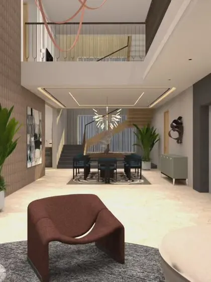 A wide view of the double-height living space, showing the connection between the lower living area, the dining space, and the upper mezzanine level. This kind of open, interconnected design is great for creating a sense of spaciousness and family connection.