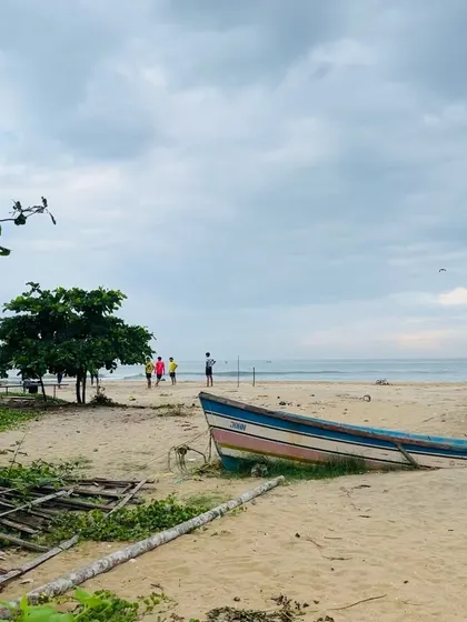 The beautiful, calm beach in my hometown that served as my inspiration. The soft sand, gentle waves, and scattered boats create a peaceful atmosphere that I love to paint.