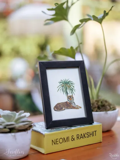 A custom-illustrated tiger graphic in a simple frame, part of the many small details that built the narrative of the safari theme.