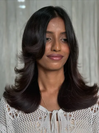 Another angle of the revitalized style, showing the beautiful shape and movement created by the new haircut.