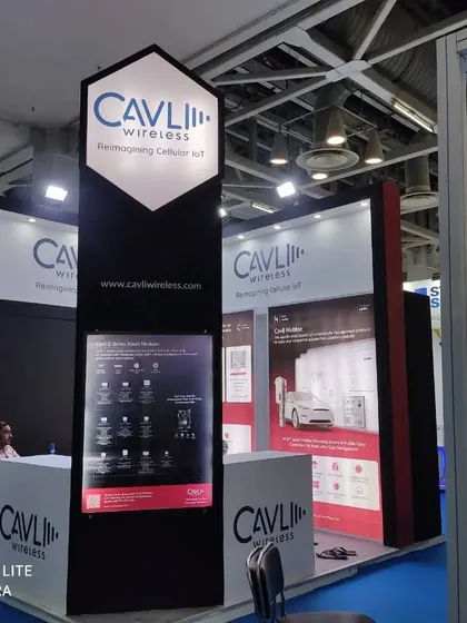 The stall I designed and fabricated for Cavli Wireless. The tall, branded pillar acts as a landmark, making the booth visible from a distance.