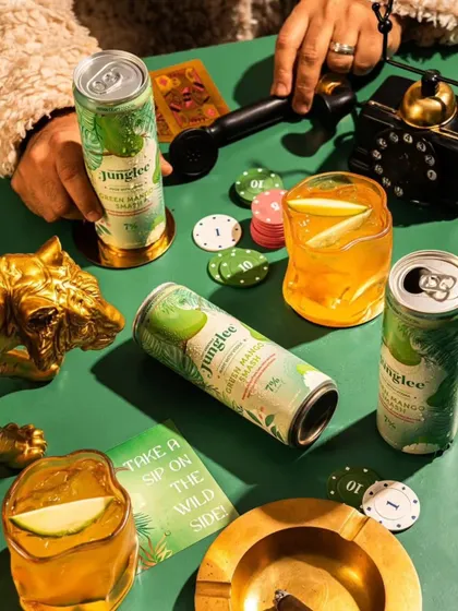 A playful, themed shot for Junglee, setting up a poker night scene. This type of lifestyle image builds a personality for the brand, associating it with social gatherings and fun.