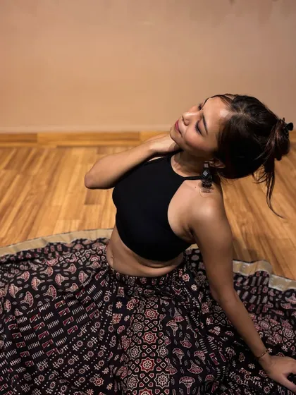 A quiet moment of reflection in my dance attire. This portrait captures the calm before the energy of a performance.