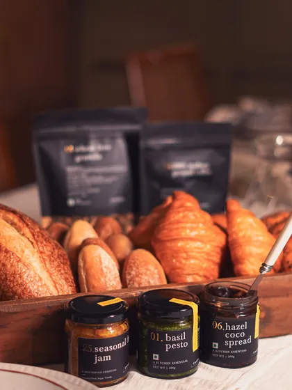 A selection of our essential pantry jars, including seasonal jam, basil pesto, and hazel coco spread. These are perfect for stocking your own kitchen or creating a custom gift hamper.