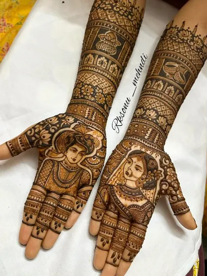 A symbol of love and tradition, this full bridal mehndi features exquisite portraits of the bride and groom. The arms are adorned with panels depicting various wedding rituals, telling a complete story.