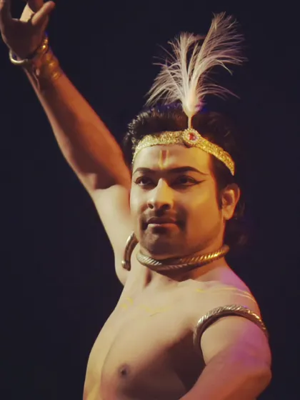 A close-up of a dancer portraying Lord Krishna, complete with a feathered headpiece. My work often involves detailed character studies from Hindu mythology.