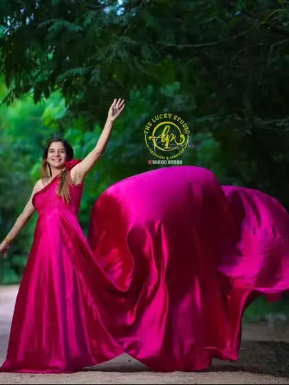 A joyful, candid shot showing the movement of the satin gown. My goal is to make expectant mothers feel beautiful and confident during their special photoshoot.