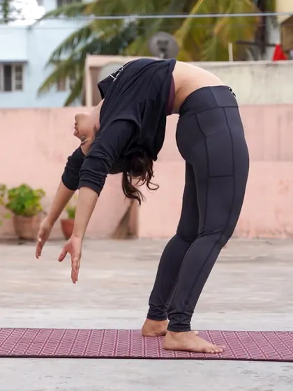 Moving into a deeper standing backbend. This shows how we can progress from supported variations to more challenging expressions of a pose as your body gets stronger.