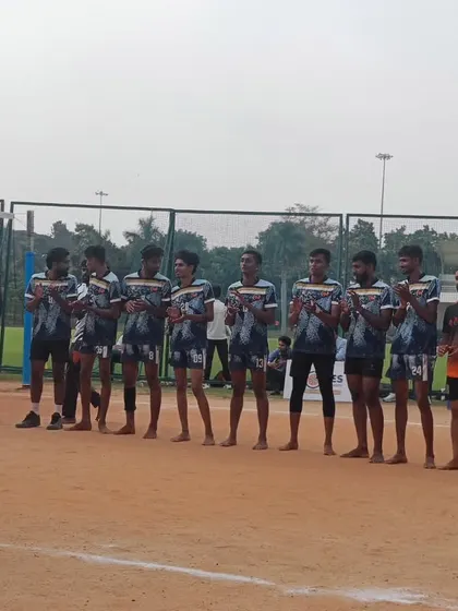 The Reva University team lined up and showing respect before a match.