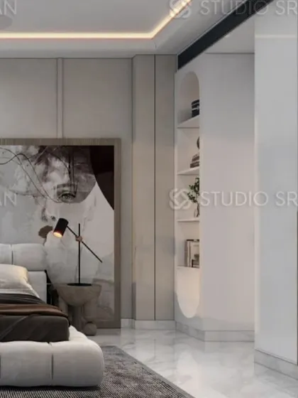 This view highlights the built-in storage, which includes an open, curved shelving unit for displaying personal items.