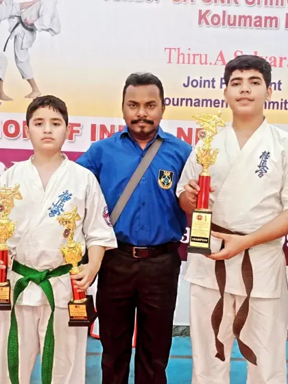 Posing with my winning team. Their success at the national level is a testament to the effectiveness of our training.