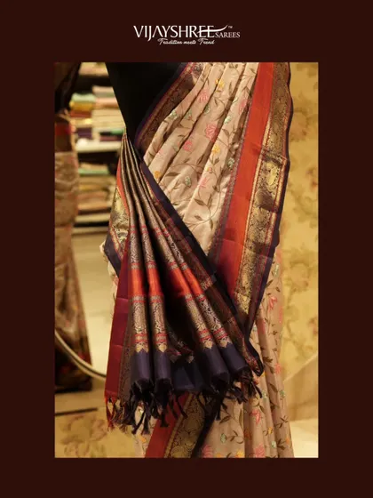 A closer look at the pallu of the fusion Kanjivaram, highlighting the delicate hand embroidery that whispers elegance.