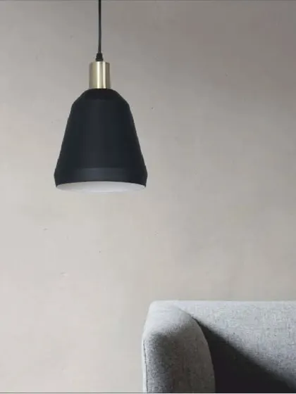 A ravishing hanging light with a black and white cone-shaped shade and an antique brass fitting. Its minimalist design is perfect for modern interiors, whether hung alone or in a series.