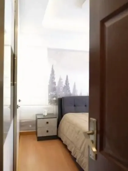 A peek into a client's bedroom, showcasing the serene and personalized space created as part of their home transformation.