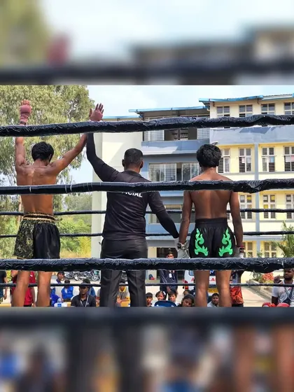 Victory at the Golden Mongkhon Muay Thai Nationals. The referee raises our fighter's hand, a moment that captures the culmination of intense training and perfect execution.