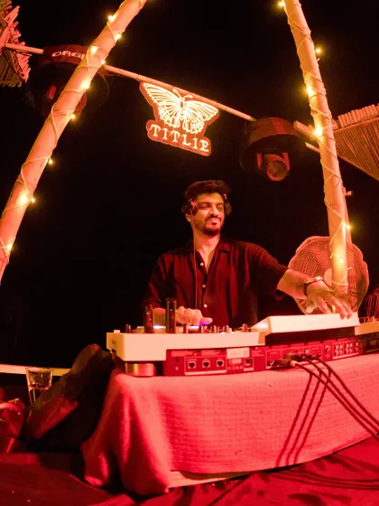 A moment of calm focus at the Titlie console, surrounded by the warm glow of the fairy lights.