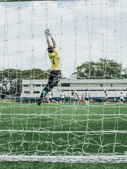 An incredible action shot of goalkeeper Akash Kola in mid-air, making a save. This demonstrates the high level of skill our players achieve.