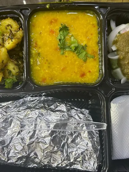 A simple and light thali with jeera aloo and yellow dal. This is a great option for those who prefer a less spicy and oily meal.
